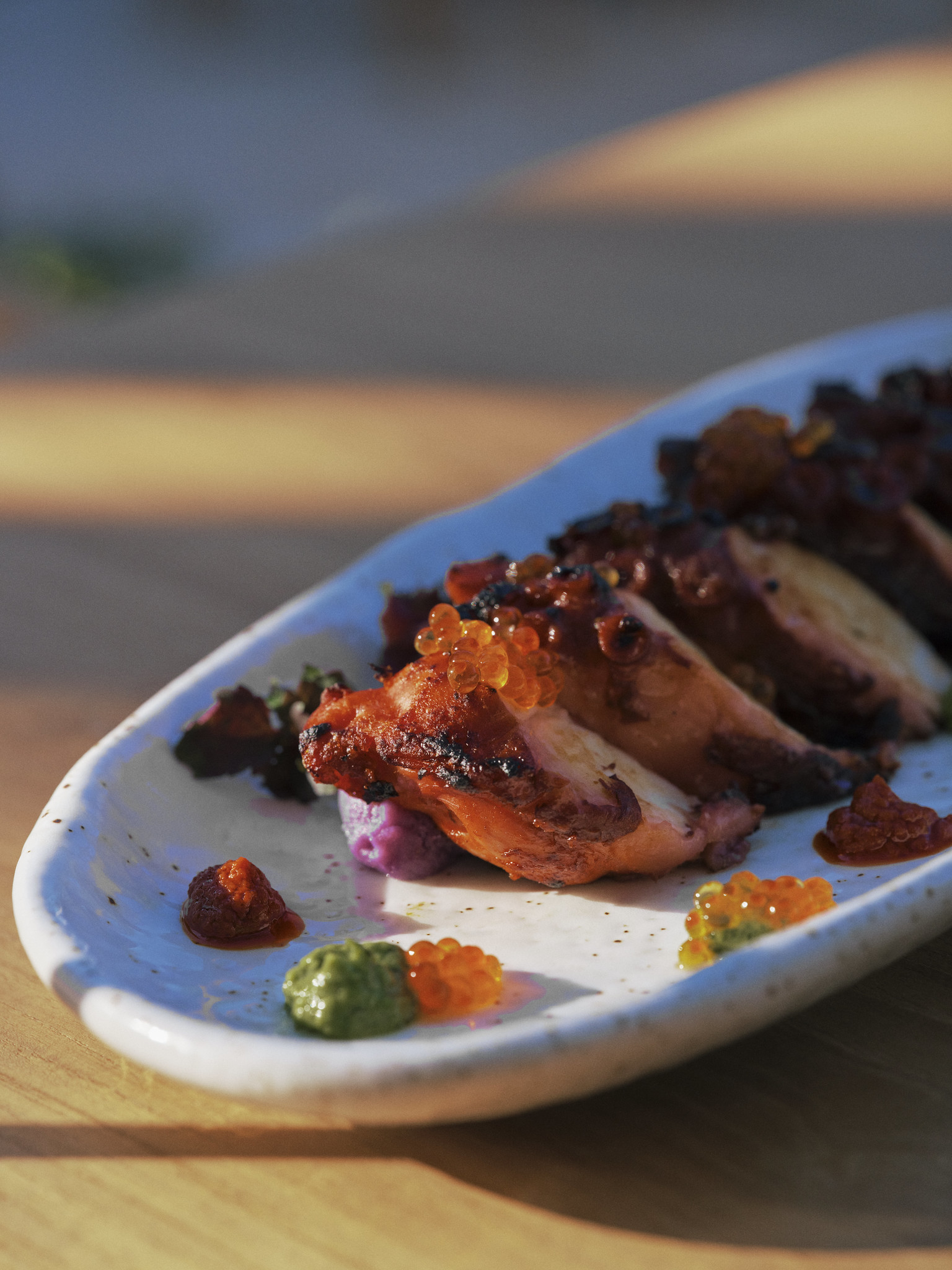Grilled octopus with roe and purple potato puree